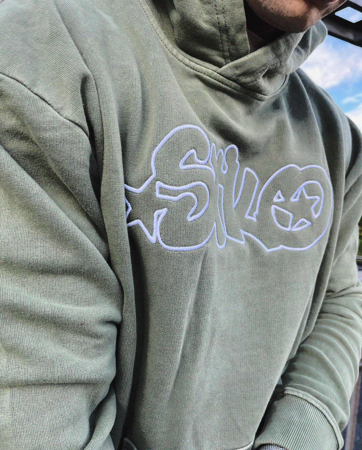 Green streetwear, hip-hop inspired hoodie.