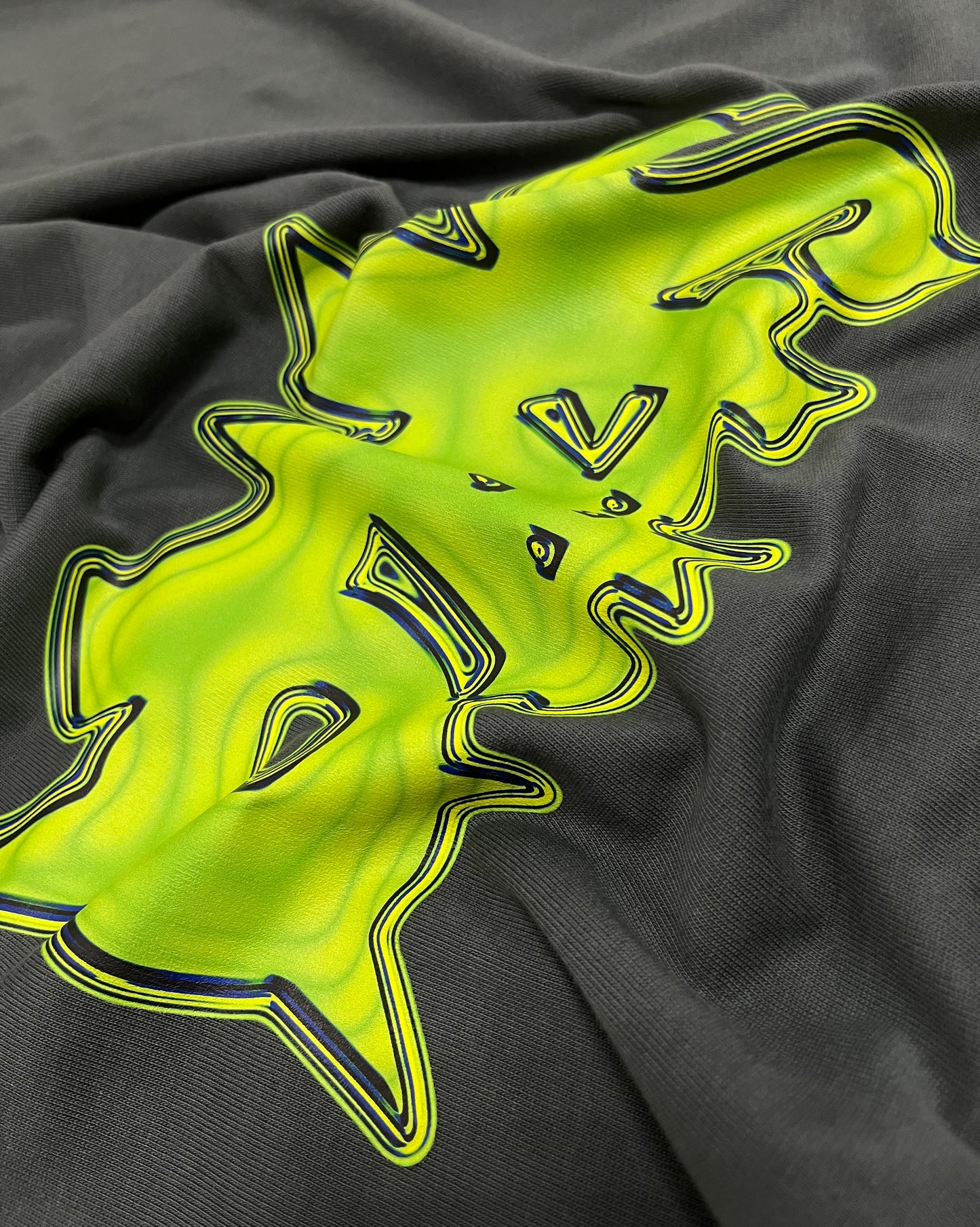 details of a green t-shirt inspired on hip-hop clothing