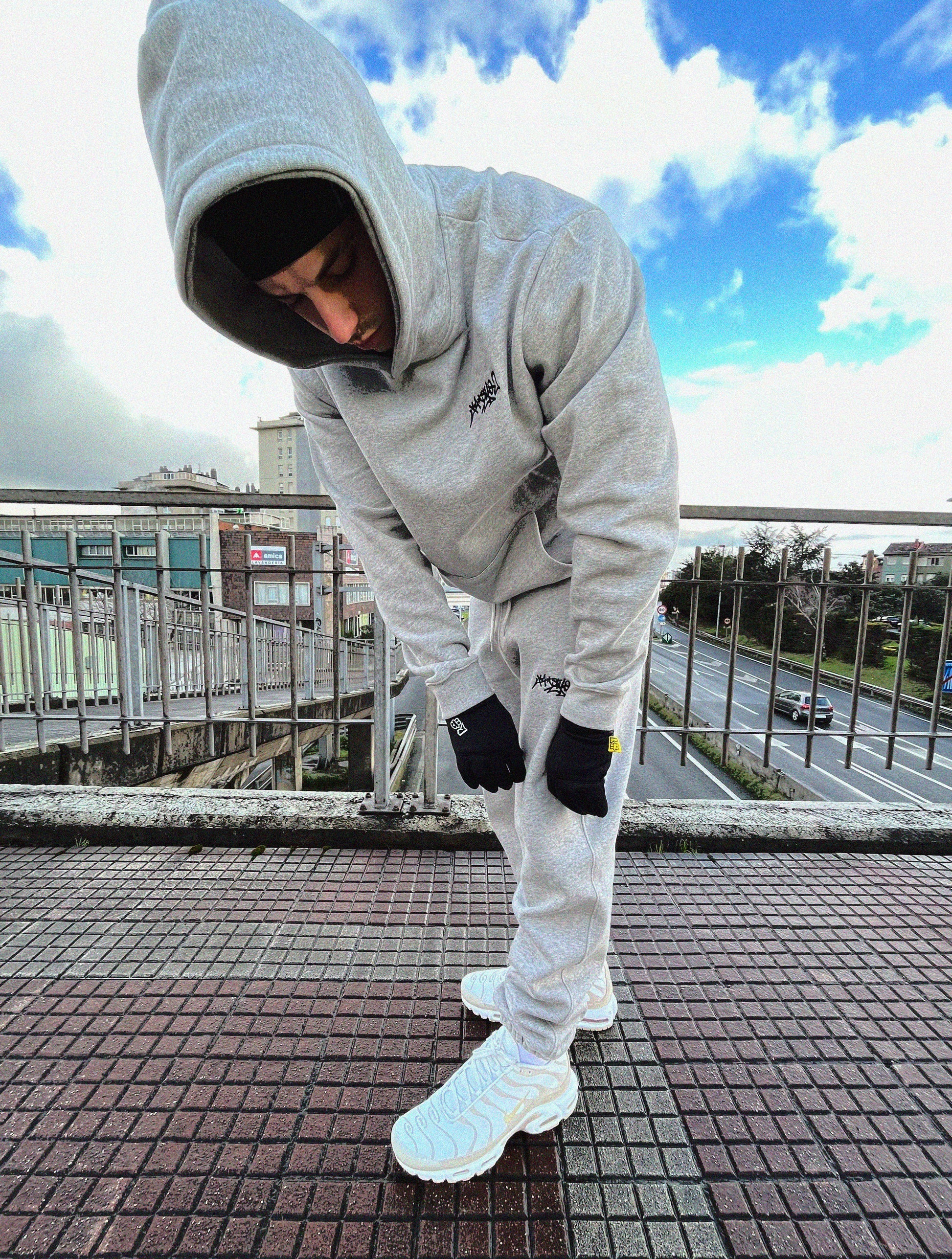 Full grey tracksuit, combining both the hoodie and the pants with matching gloves. Streetwear at it's finest.