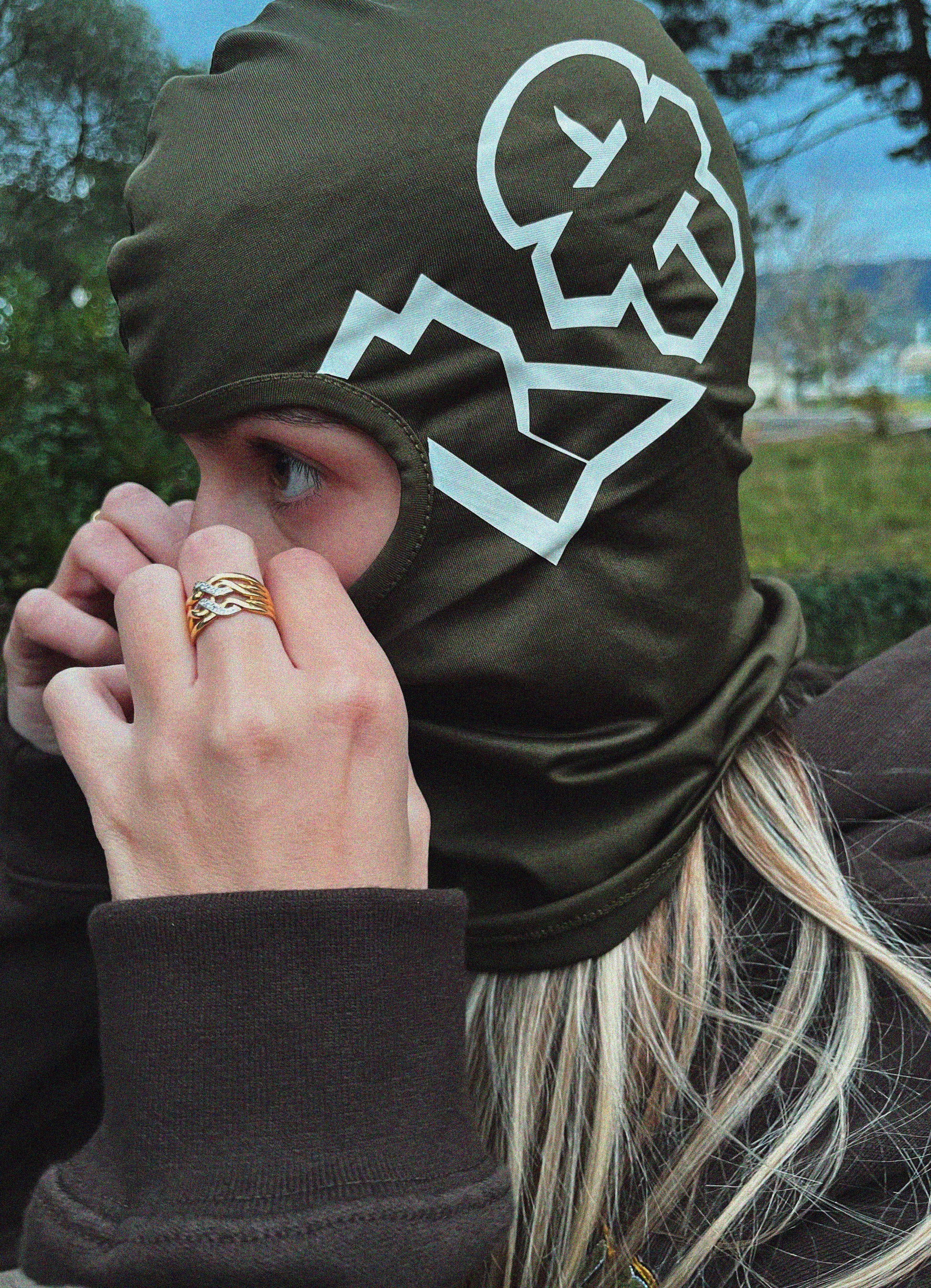 urban girl wearing a balaclava in green, perfect for hip-hop and streetwear lovers