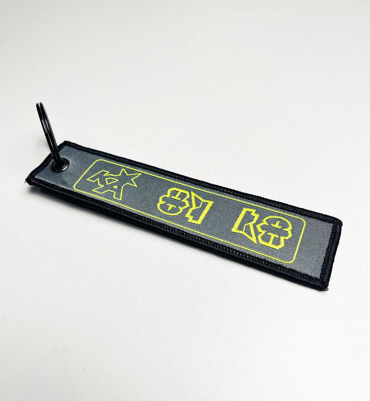 Ka Grey Fabric Keychain